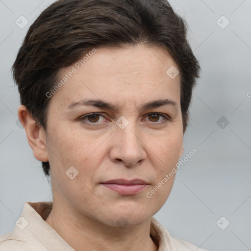 Joyful white adult female with short  brown hair and brown eyes