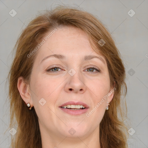 Joyful white adult female with medium  brown hair and blue eyes