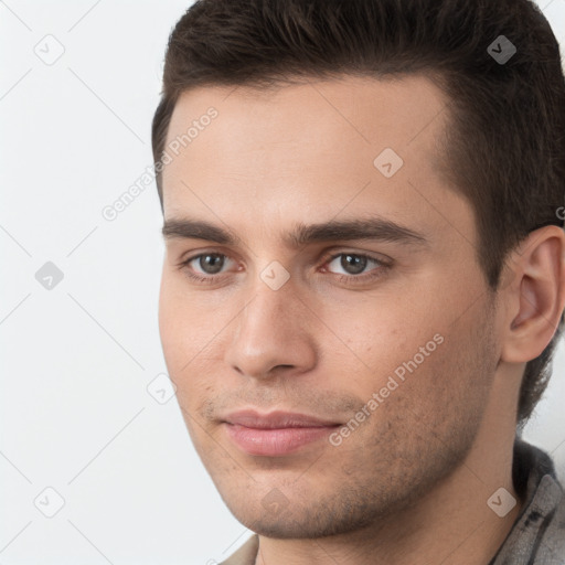 Neutral white young-adult male with short  brown hair and brown eyes