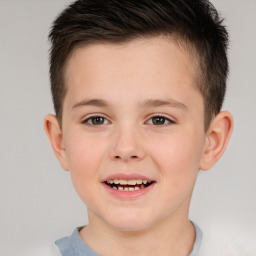 Joyful white child male with short  brown hair and brown eyes