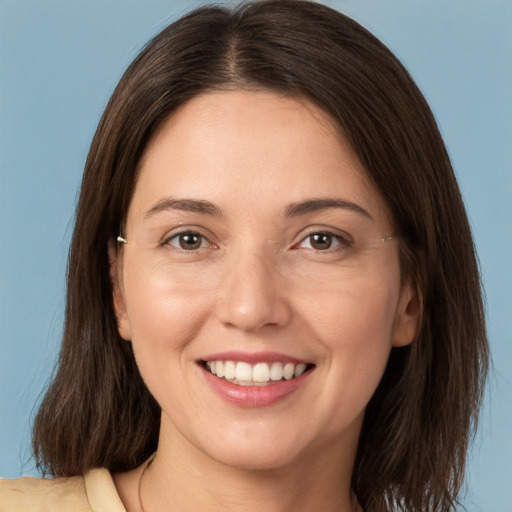 Joyful white young-adult female with medium  brown hair and brown eyes