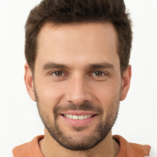 Joyful white young-adult male with short  brown hair and brown eyes