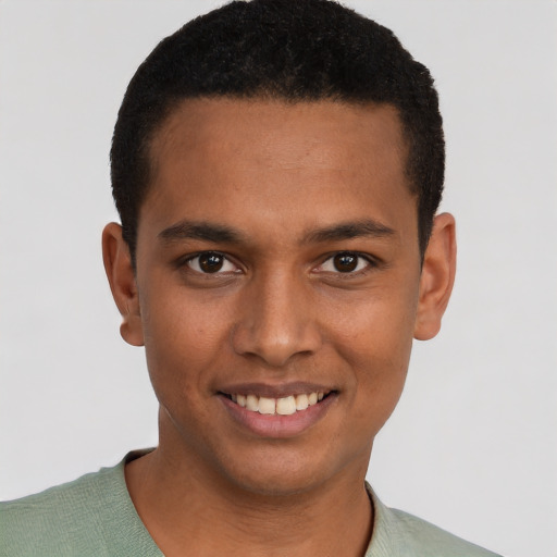 Joyful black young-adult male with short  brown hair and brown eyes