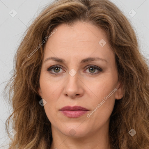 Joyful white adult female with long  brown hair and brown eyes