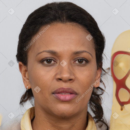 Joyful black adult female with medium  brown hair and brown eyes