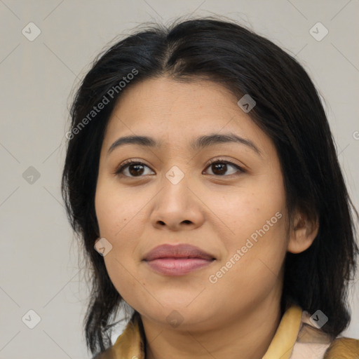 Joyful latino young-adult female with medium  brown hair and brown eyes