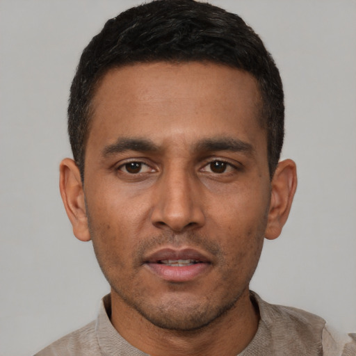 Neutral latino young-adult male with short  black hair and brown eyes