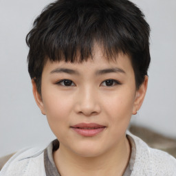 Joyful white child female with short  brown hair and brown eyes