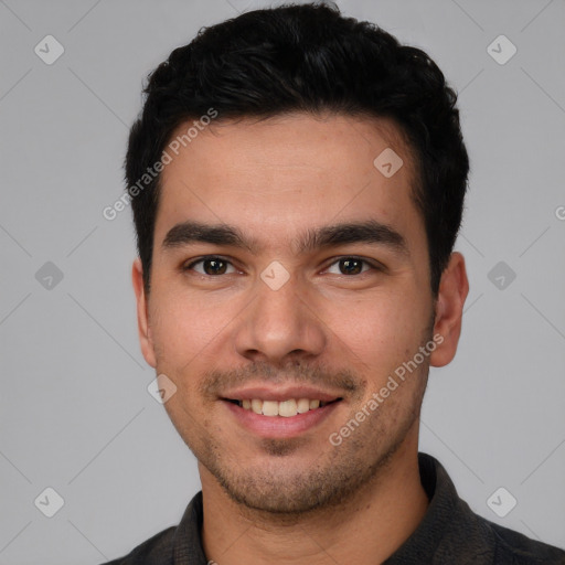 Joyful white young-adult male with short  black hair and brown eyes