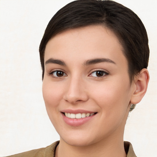 Joyful white young-adult female with short  brown hair and brown eyes