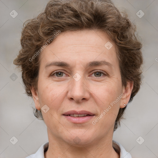 Joyful white adult female with short  brown hair and brown eyes