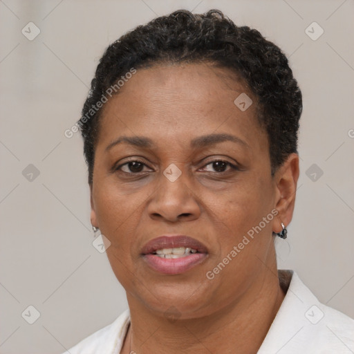 Joyful black adult female with short  brown hair and brown eyes