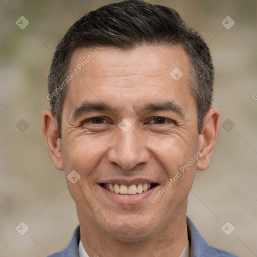 Joyful white adult male with short  brown hair and brown eyes