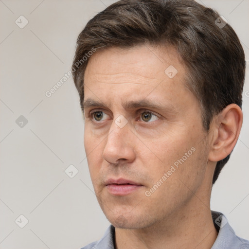 Neutral white adult male with short  brown hair and brown eyes