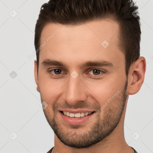 Joyful white young-adult male with short  brown hair and brown eyes