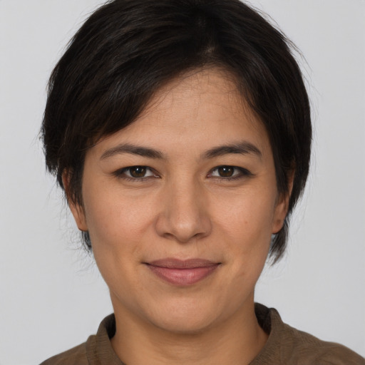 Joyful white young-adult female with medium  brown hair and brown eyes