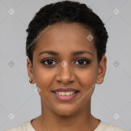 Joyful black young-adult female with short  black hair and brown eyes