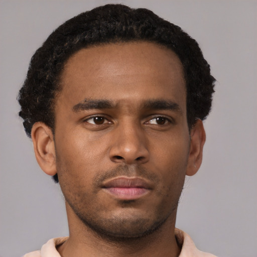 Neutral black young-adult male with short  black hair and brown eyes