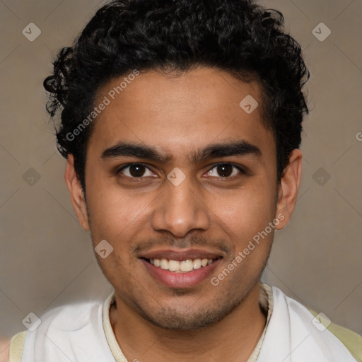 Joyful latino young-adult male with short  brown hair and brown eyes