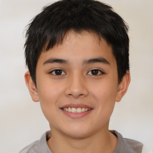 Joyful white child male with short  brown hair and brown eyes