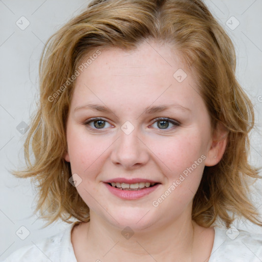 Joyful white young-adult female with medium  brown hair and blue eyes