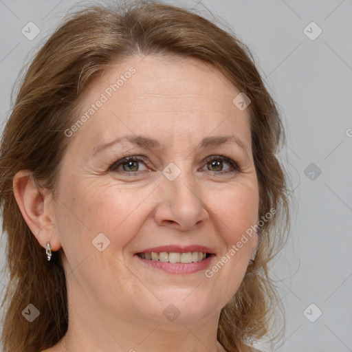 Joyful white adult female with medium  brown hair and grey eyes