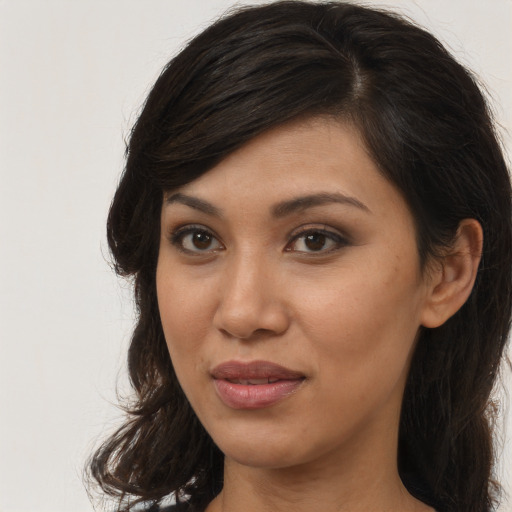Joyful asian young-adult female with long  brown hair and brown eyes