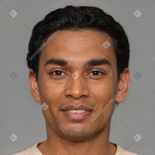 Joyful latino young-adult male with short  black hair and brown eyes