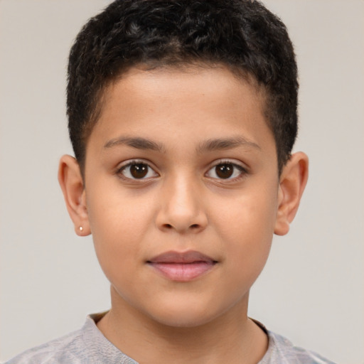 Joyful white child male with short  brown hair and brown eyes