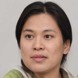 Joyful white young-adult female with medium  brown hair and brown eyes