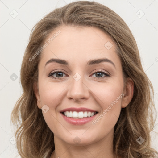 Joyful white young-adult female with long  brown hair and grey eyes