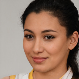 Joyful latino young-adult female with medium  brown hair and brown eyes