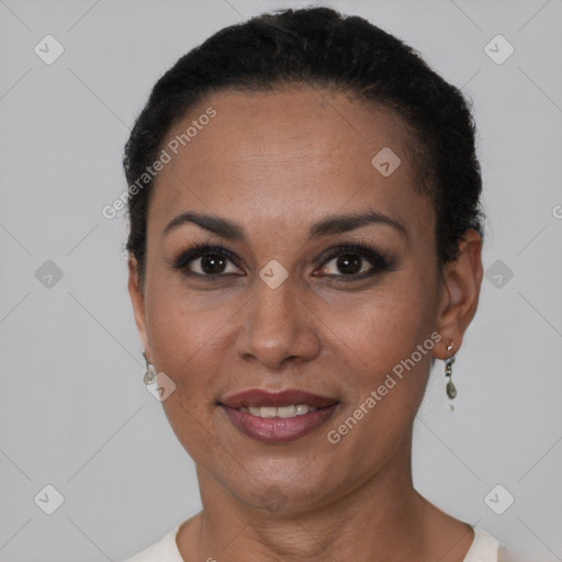 Joyful black adult female with short  black hair and brown eyes