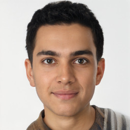 Joyful latino young-adult male with short  brown hair and brown eyes