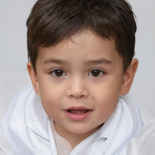 Joyful white child male with short  brown hair and brown eyes