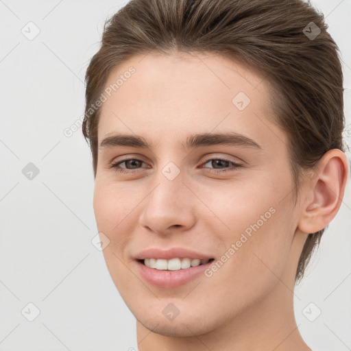 Joyful white young-adult female with short  brown hair and brown eyes