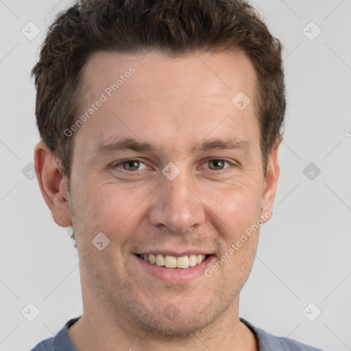 Joyful white adult male with short  brown hair and grey eyes