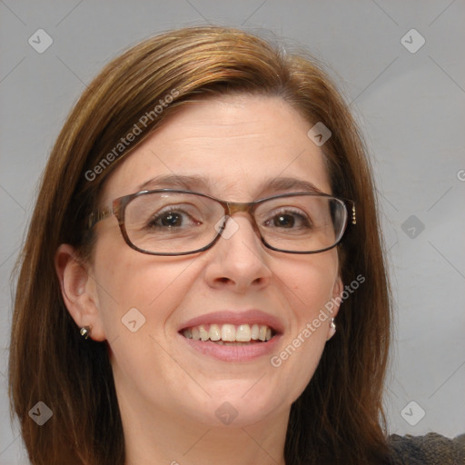 Joyful white adult female with medium  brown hair and blue eyes