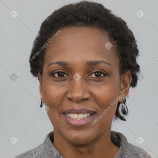 Joyful black adult female with short  brown hair and brown eyes