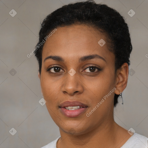 Joyful black young-adult female with short  black hair and brown eyes