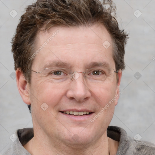 Joyful white adult male with short  brown hair and grey eyes