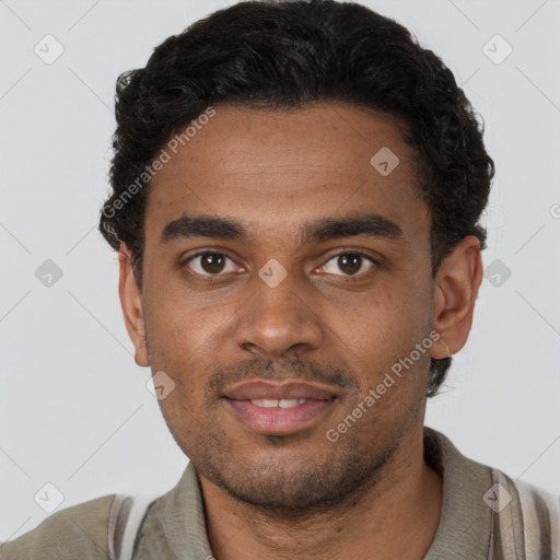 Joyful black young-adult male with short  brown hair and brown eyes