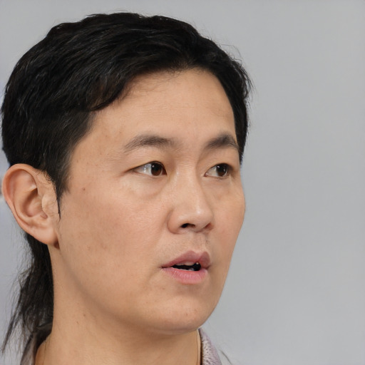 Neutral asian adult male with short  black hair and brown eyes