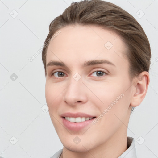 Joyful white young-adult female with short  brown hair and brown eyes