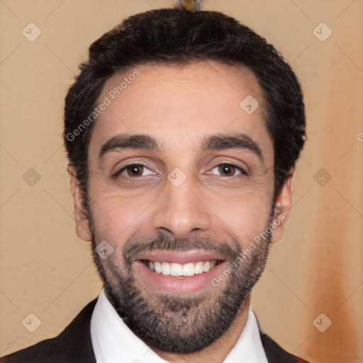 Joyful white young-adult male with short  black hair and brown eyes