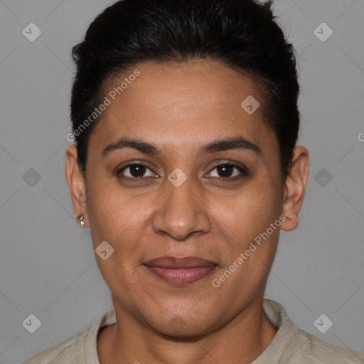 Joyful latino adult female with short  brown hair and brown eyes