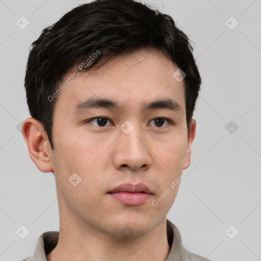 Neutral white young-adult male with short  black hair and brown eyes