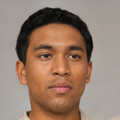 Neutral latino young-adult male with short  black hair and brown eyes