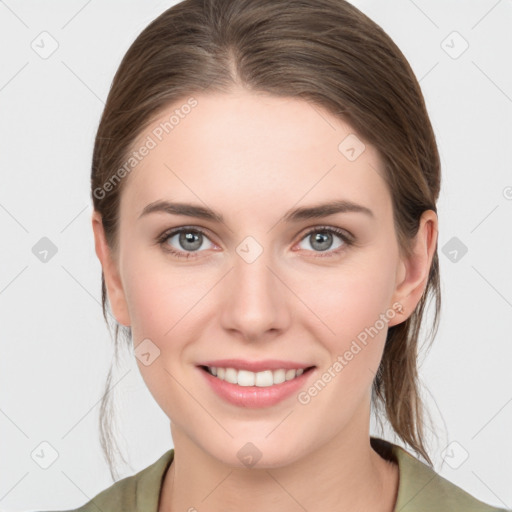 Joyful white young-adult female with medium  brown hair and grey eyes