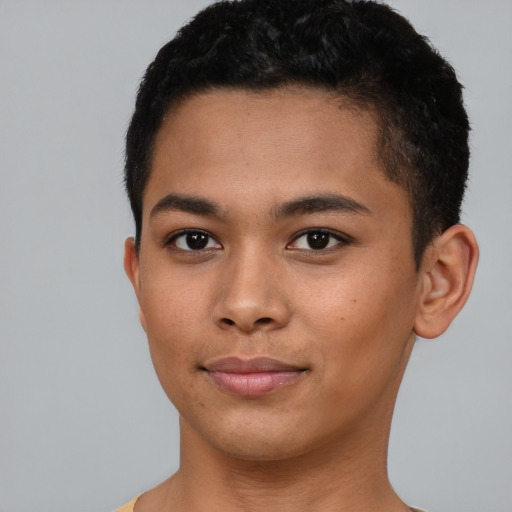 Joyful black young-adult male with short  brown hair and brown eyes